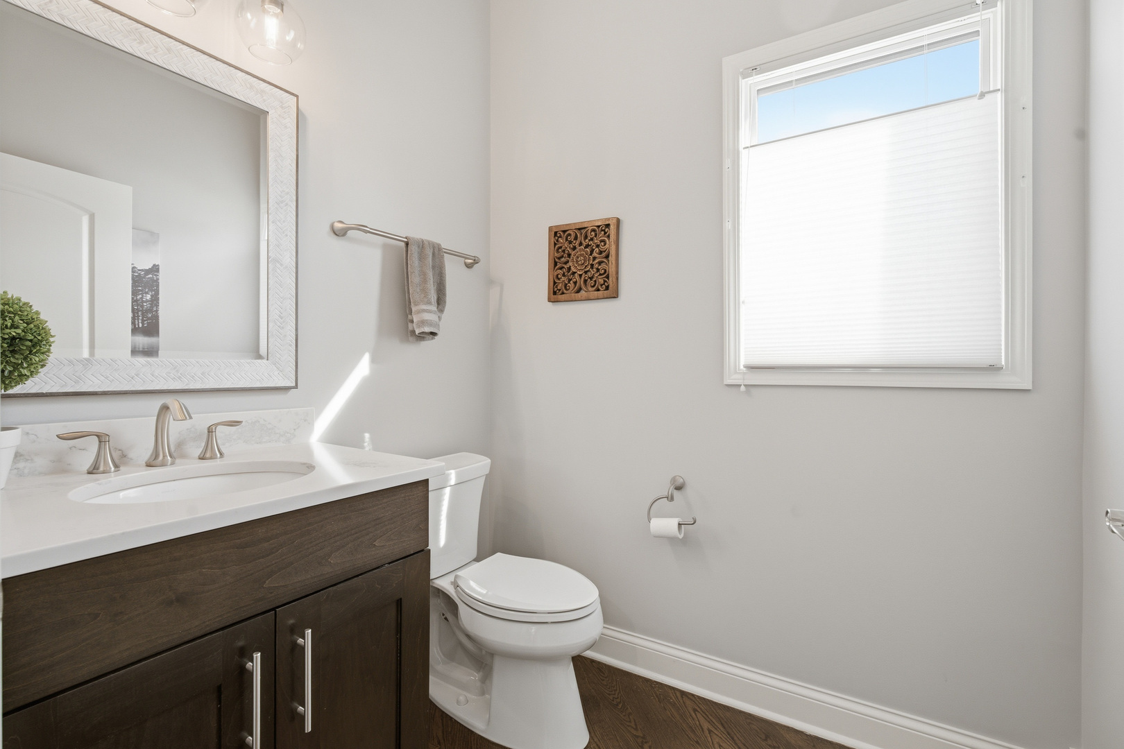 28 Pinnacle Court Naperville, IL 60565 - Photo 28 of 40 a bathroom with a toilet a sink a vanity and mirror