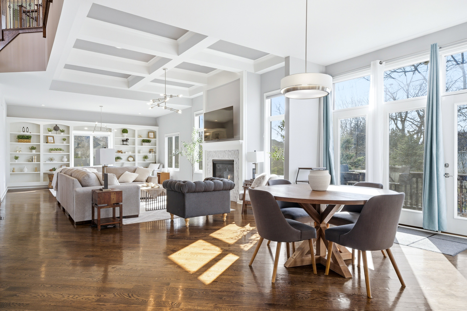 28 Pinnacle Court Naperville, IL 60565 - Photo 7 of 40 a view of a dining room with furniture wooden floor and chandelier