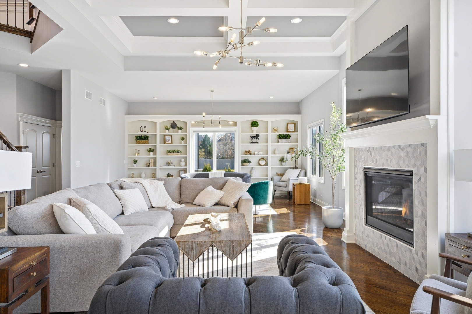 28 Pinnacle Court Naperville, IL 60565 - Photo 8 of 40 a living room with furniture a flat screen tv and a fireplace