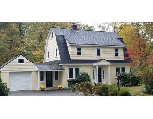 412 South Meadow Road Lancaster, MA 01523 - Photo 2 of 24 a front view of a house with a garden