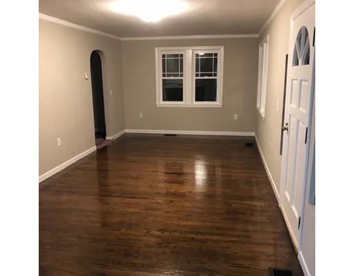 412 South Meadow Road Lancaster, MA 01523 - Photo 8 of 24 a view of an empty room with wooden floor and a window