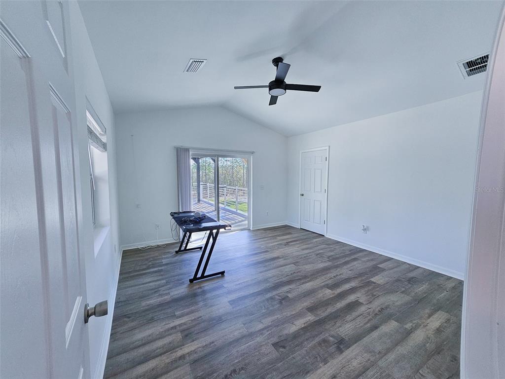 12293 Southwest 89th Street Dunnellon, FL 34432 - Photo 12 of 21 a view of a room with a window and wooden floor