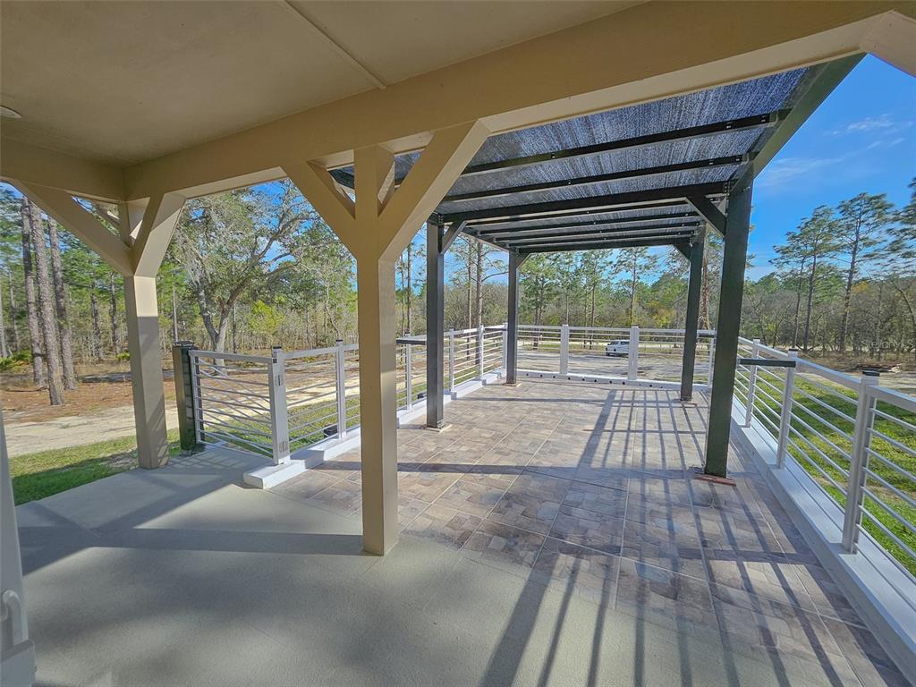 12293 Southwest 89th Street Dunnellon, FL 34432 - Photo 13 of 21 a view of porch with a floor to ceiling window and a table