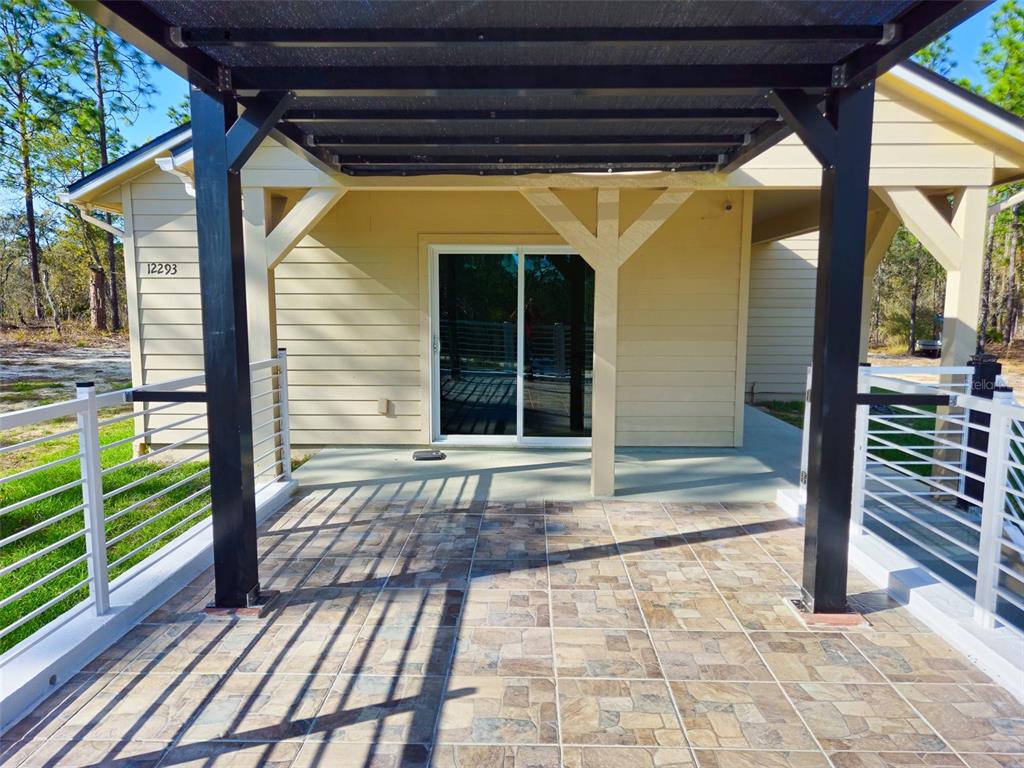 12293 Southwest 89th Street Dunnellon, FL 34432 - Photo 14 of 21 a view of a porch with a door