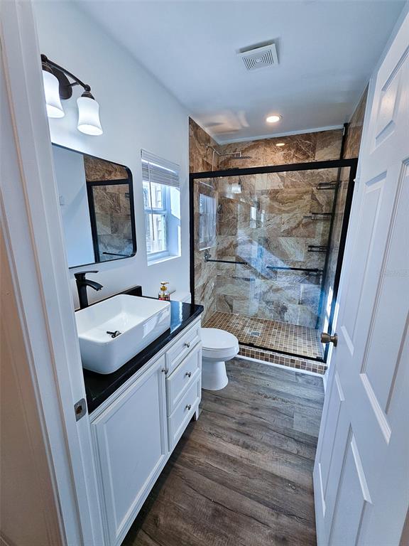 12293 Southwest 89th Street Dunnellon, FL 34432 - Photo 16 of 21 a bathroom with a granite countertop sink toilet and shower
