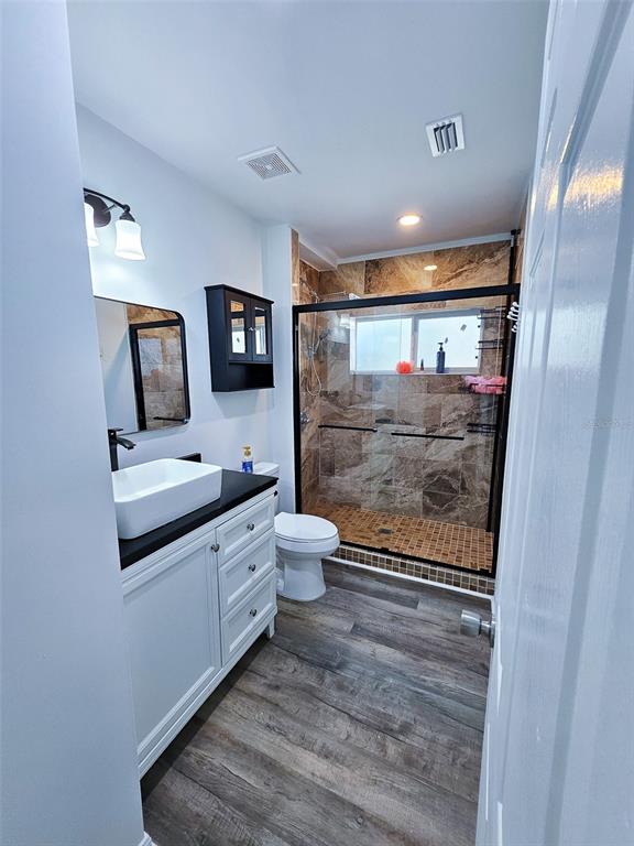 12293 Southwest 89th Street Dunnellon, FL 34432 - Photo 19 of 21 a bathroom with a toilet sink and mirror