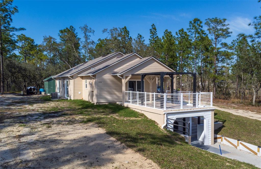 12293 Southwest 89th Street Dunnellon, FL 34432 - Photo 2 of 21 a front view of a house with a yard