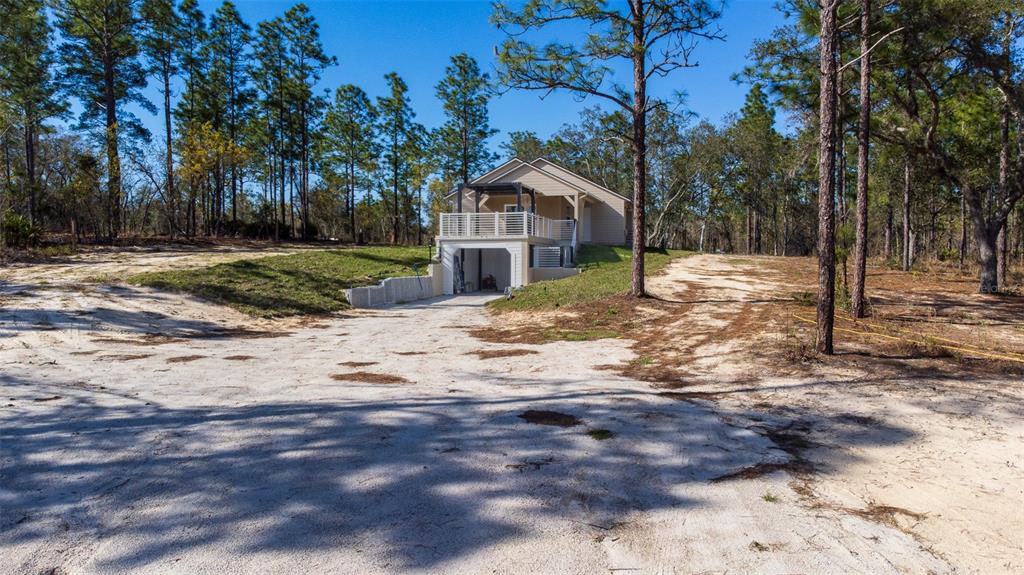 12293 Southwest 89th Street Dunnellon, FL 34432 - Photo 4 of 21 a view of a house with a yard