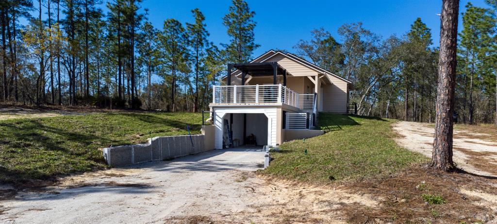 12293 Southwest 89th Street Dunnellon, FL 34432 - Photo 5 of 21 a front view of a house with a yard