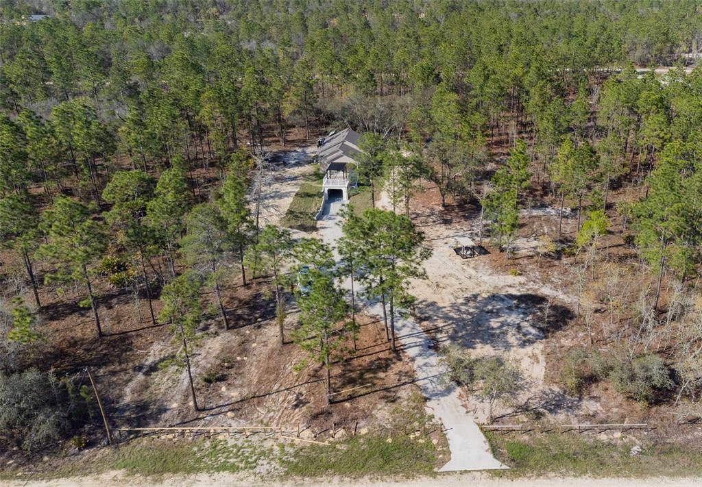 12293 Southwest 89th Street Dunnellon, FL 34432 - Photo 6 of 21 a aerial view of residential house with parking space