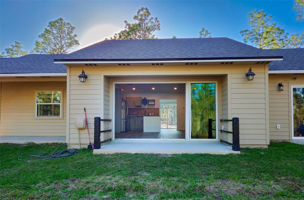 12293 Southwest 89th Street Dunnellon, FL 34432 - Photo 8 of 21 a front view of a house with a garden
