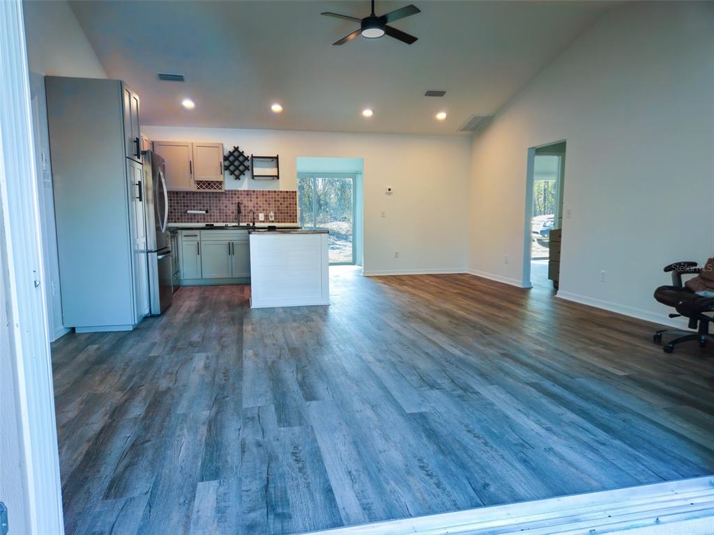 12293 Southwest 89th Street Dunnellon, FL 34432 - Photo 9 of 21 a view of kitchen and wooden floor