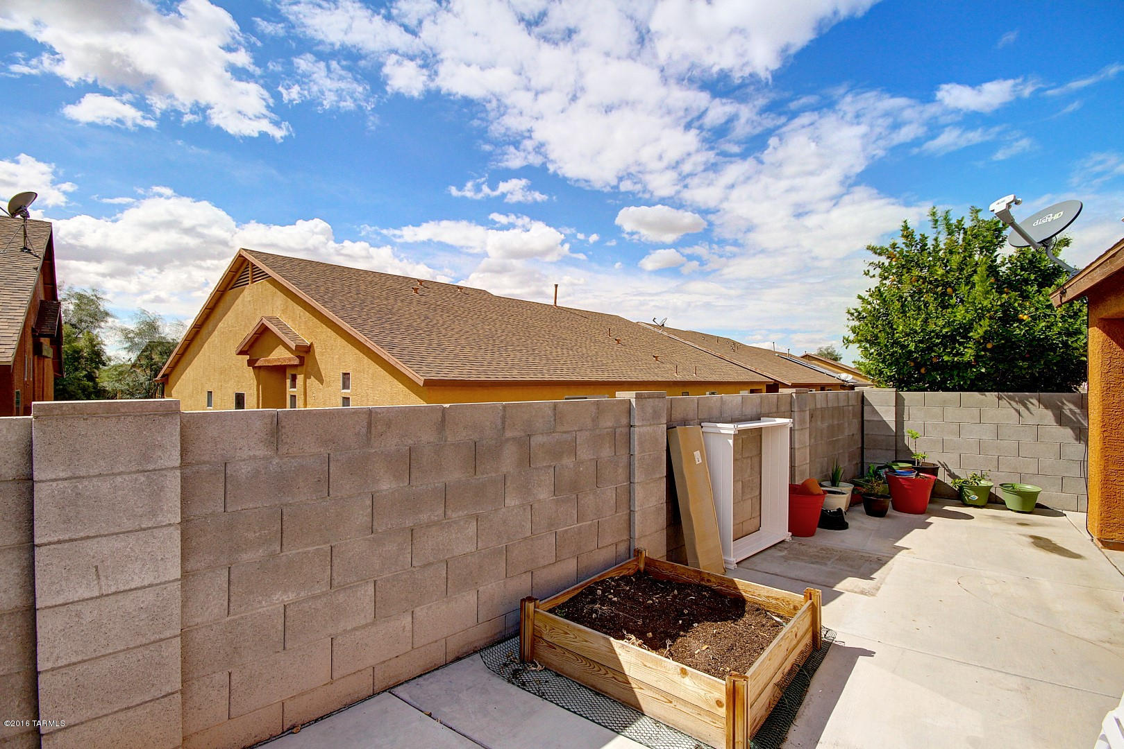 6016 South Avenida Ribero Tucson, AZ 85706 - Photo 14 of 15 a backyard of a house with table and chairs