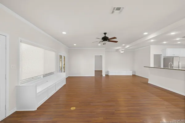 a living room with furniture wooden floor and a rug