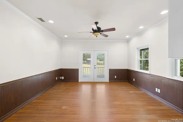 a kitchen with stainless steel appliances granite countertop a refrigerator a sink and a stove