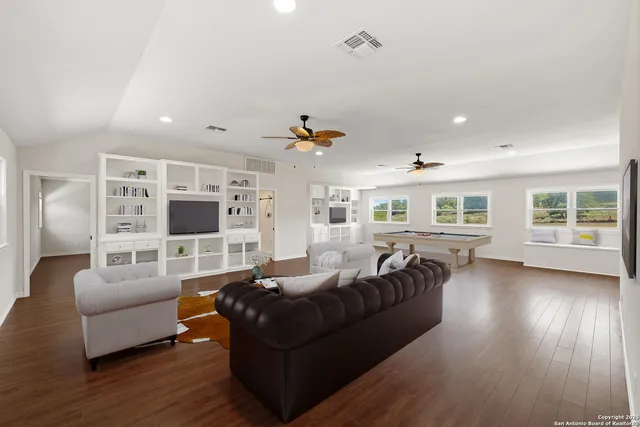 a view of kitchen and hall with wooden floor