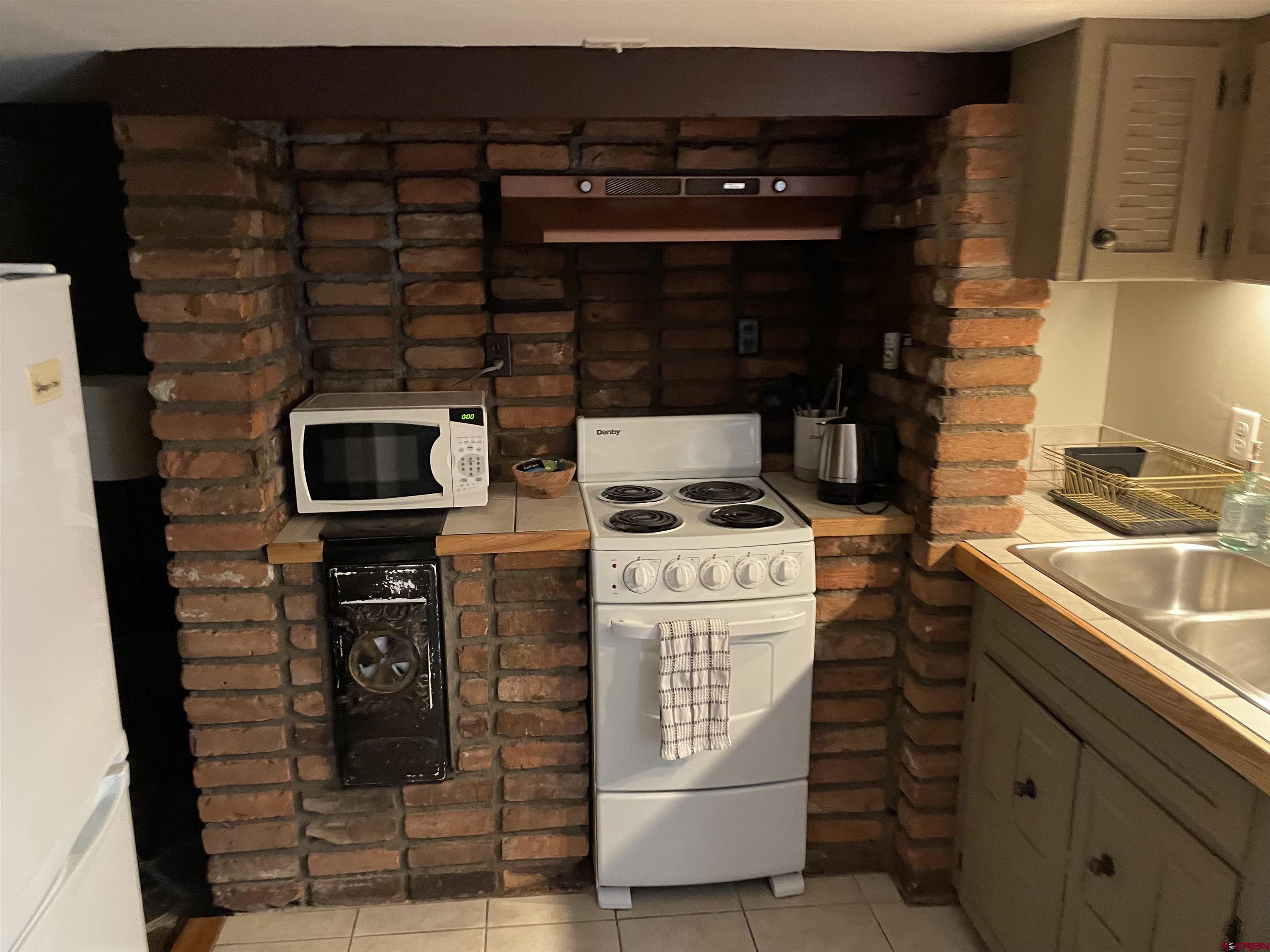 232 Main Street Ouray, CO 81427 - Photo 17 of 21 Kitchen area in lower-level rustic, historic apartment