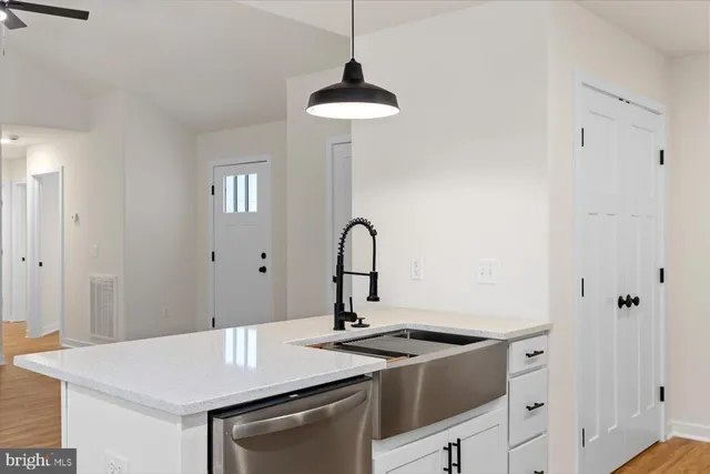 a view of a kitchen counter space a sink and a stove