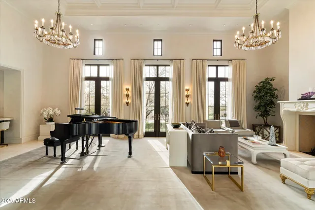 a view of a dining room with furniture large windows and wooden floor