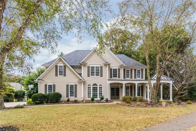 a front view of a house with a yard