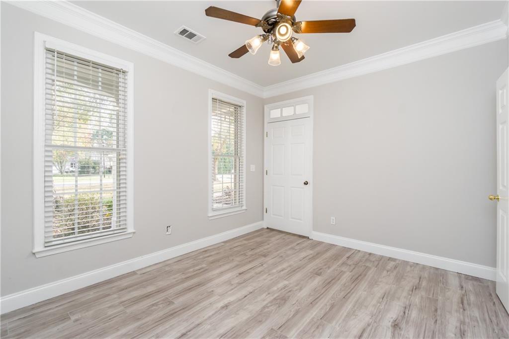 6710 Timber Cove Cumming, GA 30041 - Photo 12 of 42 wooden floor in an empty room with a window