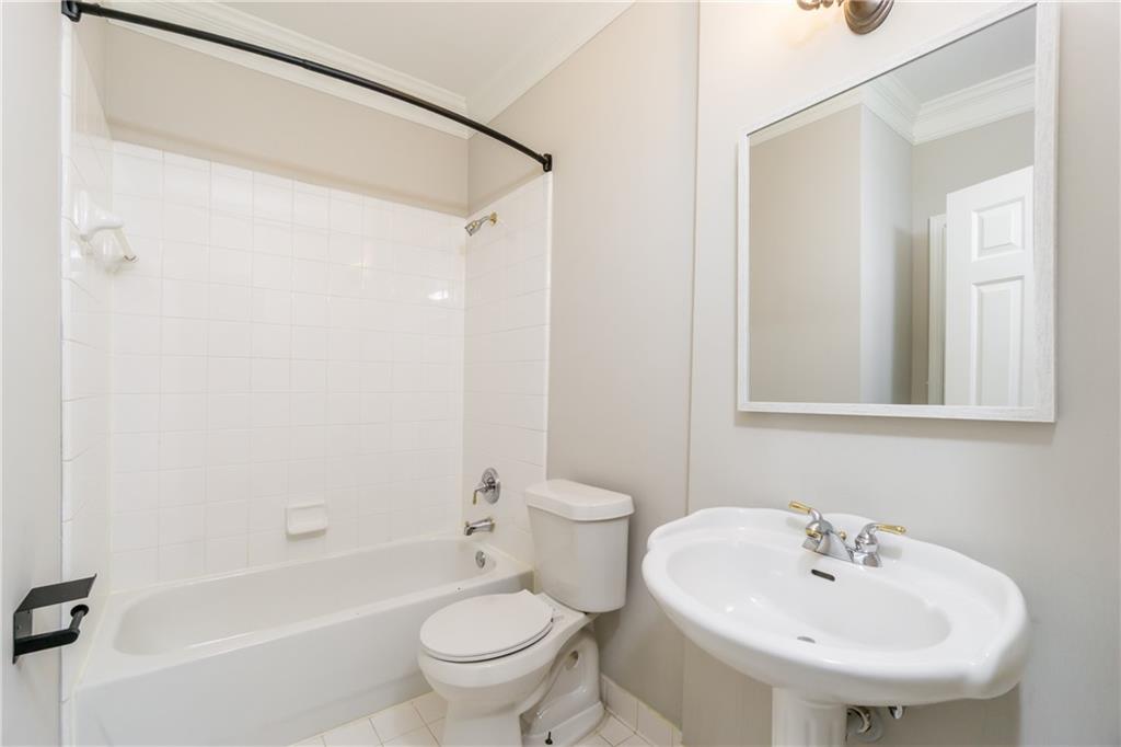 6710 Timber Cove Cumming, GA 30041 - Photo 16 of 42 a bathroom with a sink toilet and shower
