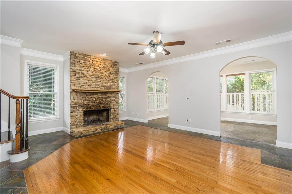 6710 Timber Cove Cumming, GA 30041 - Photo 18 of 42 a view of an empty room with a fireplace and a window