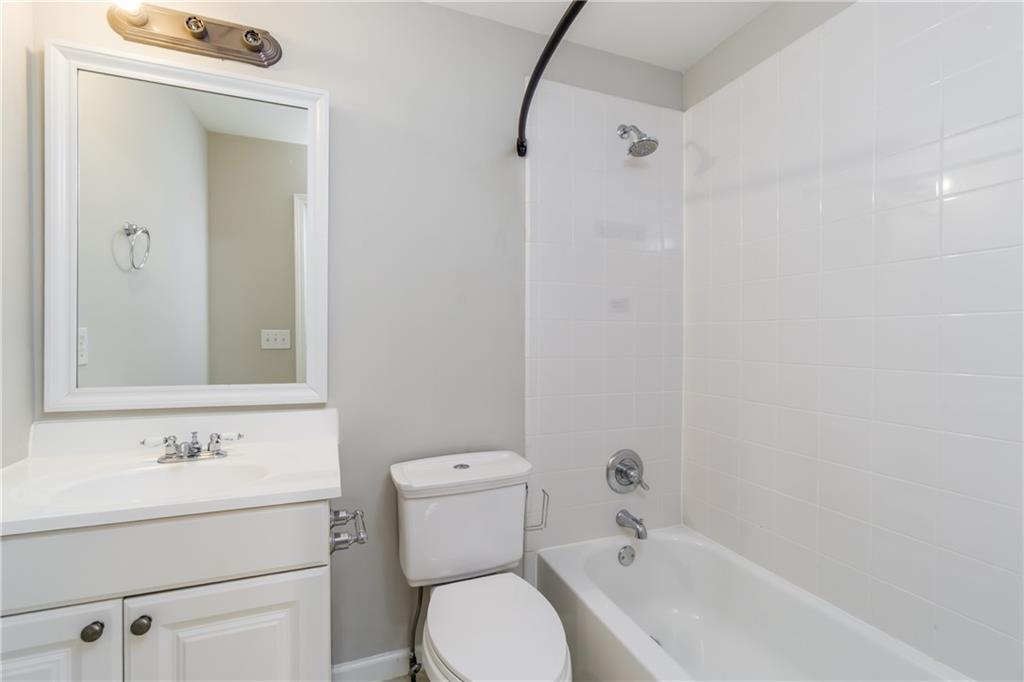 6710 Timber Cove Cumming, GA 30041 - Photo 31 of 42 a bathroom with a sink toilet and shower