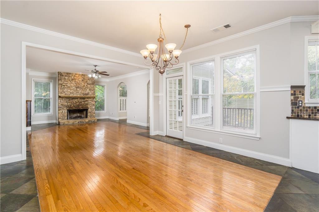 6710 Timber Cove Cumming, GA 30041 - Photo 5 of 42 a view of an empty room with a fireplace and a window