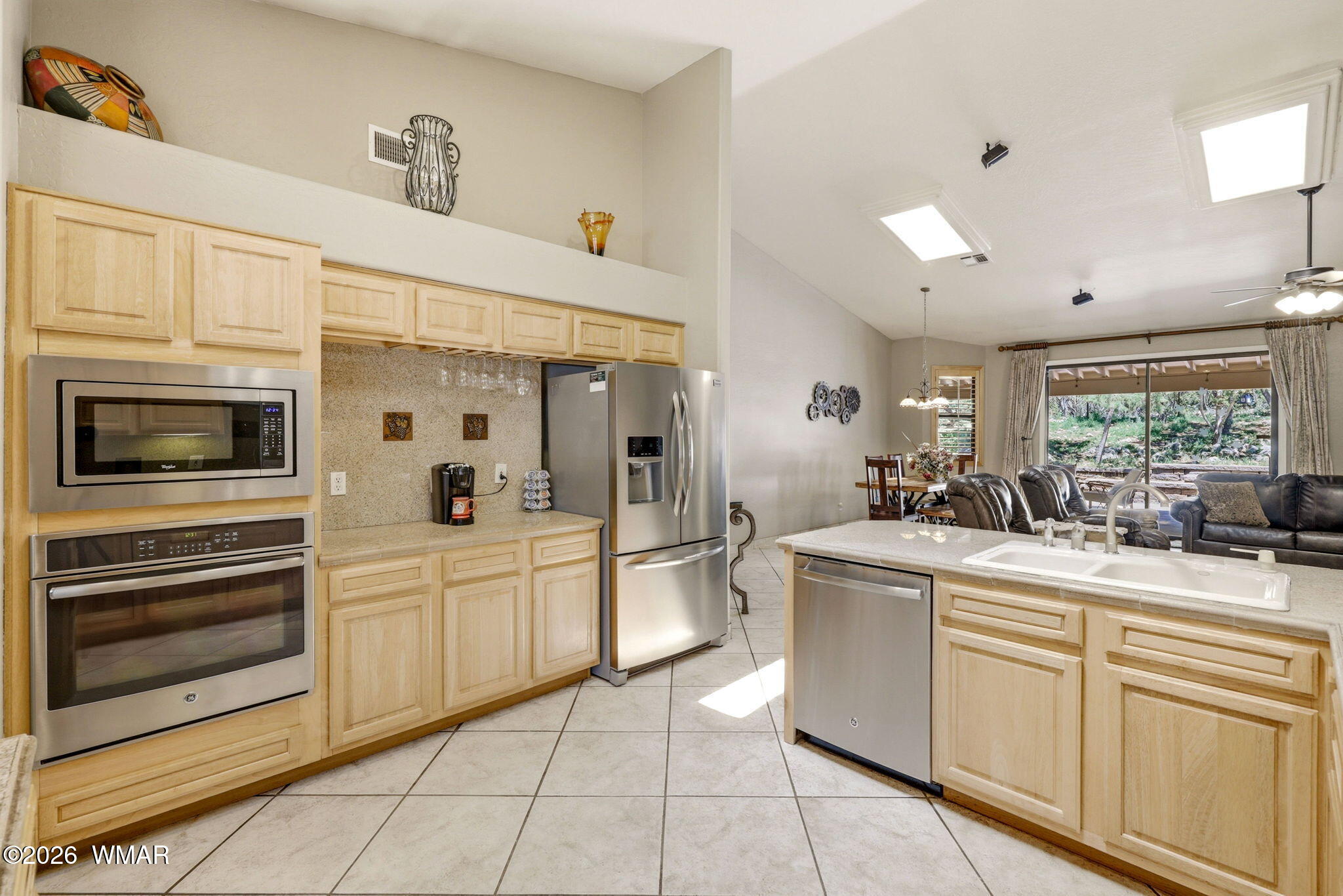 2236 Roundabout Way Overgaard, AZ 85933 - Photo 12 of 45 a kitchen with white cabinets and white appliances