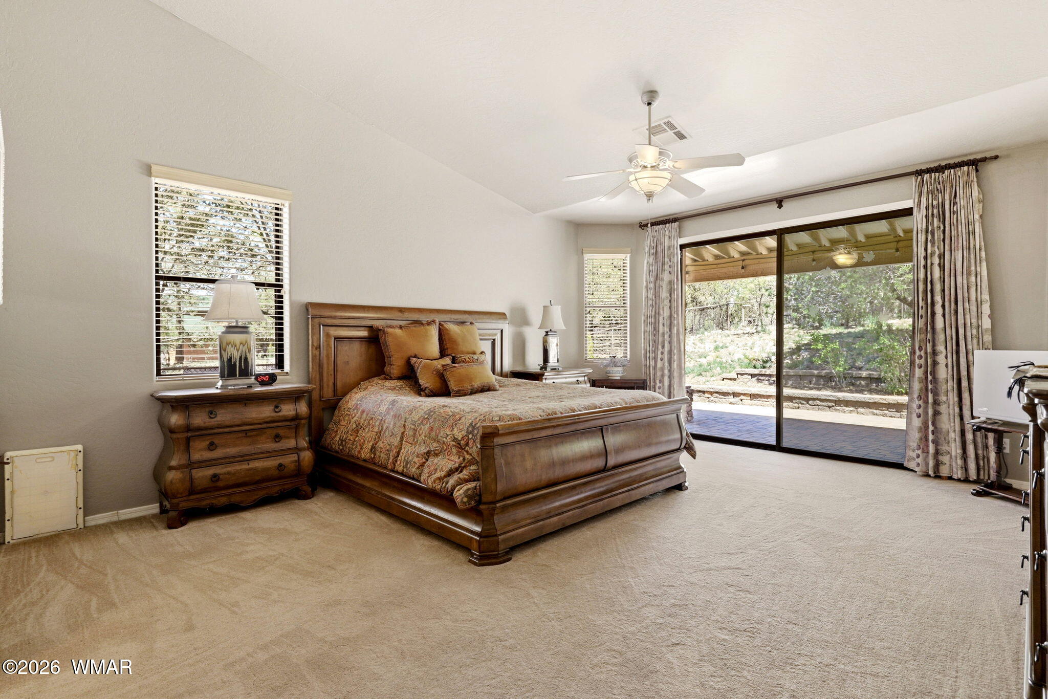 2236 Roundabout Way Overgaard, AZ 85933 - Photo 14 of 45 a bedroom with a bed and a large window