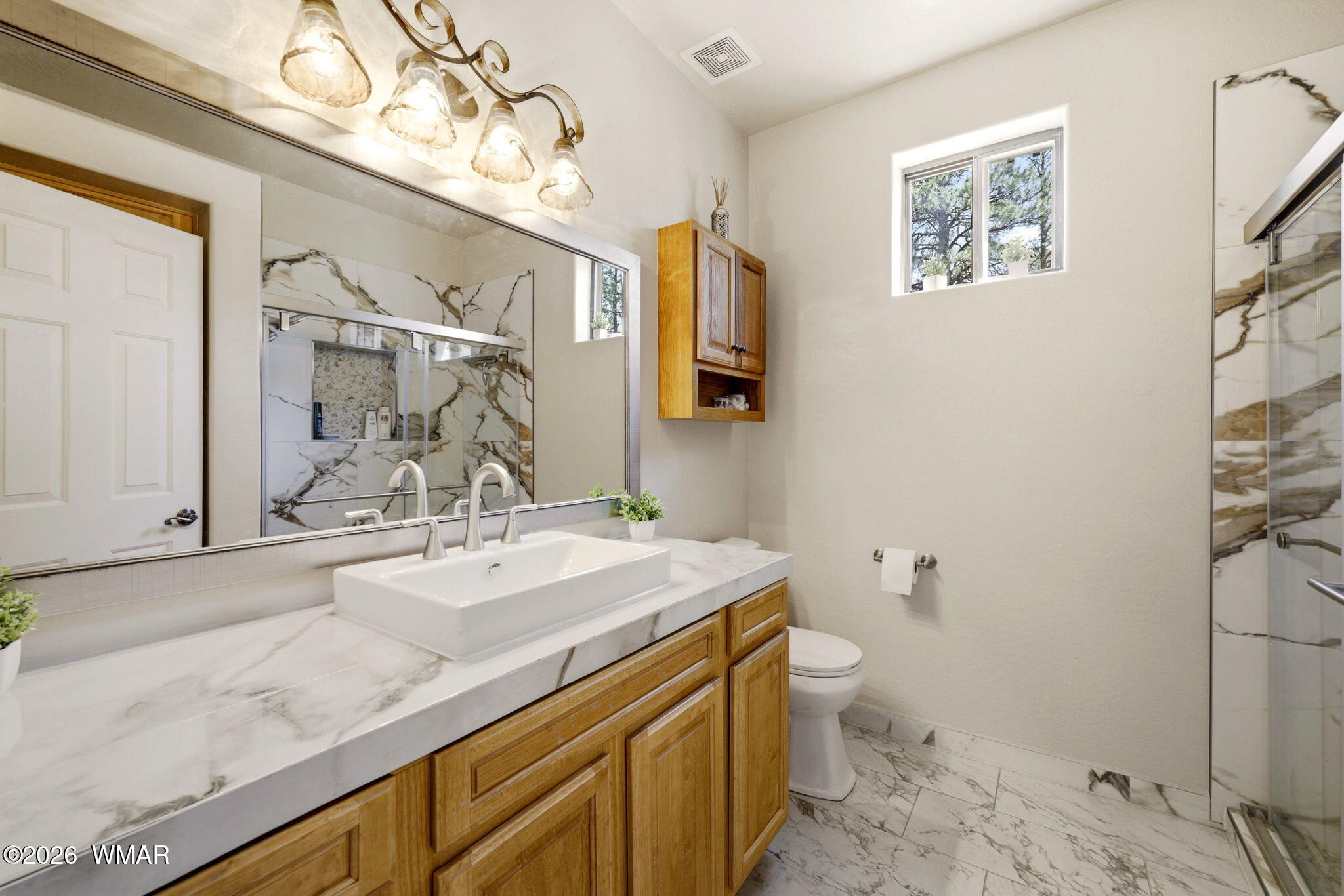 2236 Roundabout Way Overgaard, AZ 85933 - Photo 20 of 45 a bathroom with a sink vanity granite and toilet