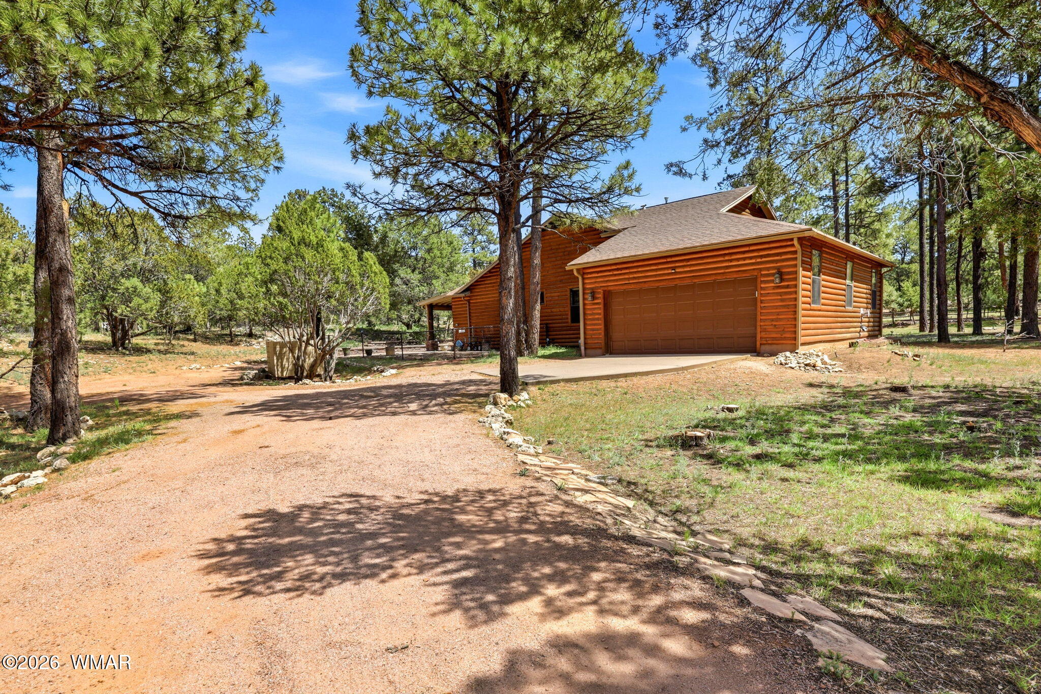 2236 Roundabout Way Overgaard, AZ 85933 - Photo 2 of 45 a view of a yard with a large tree