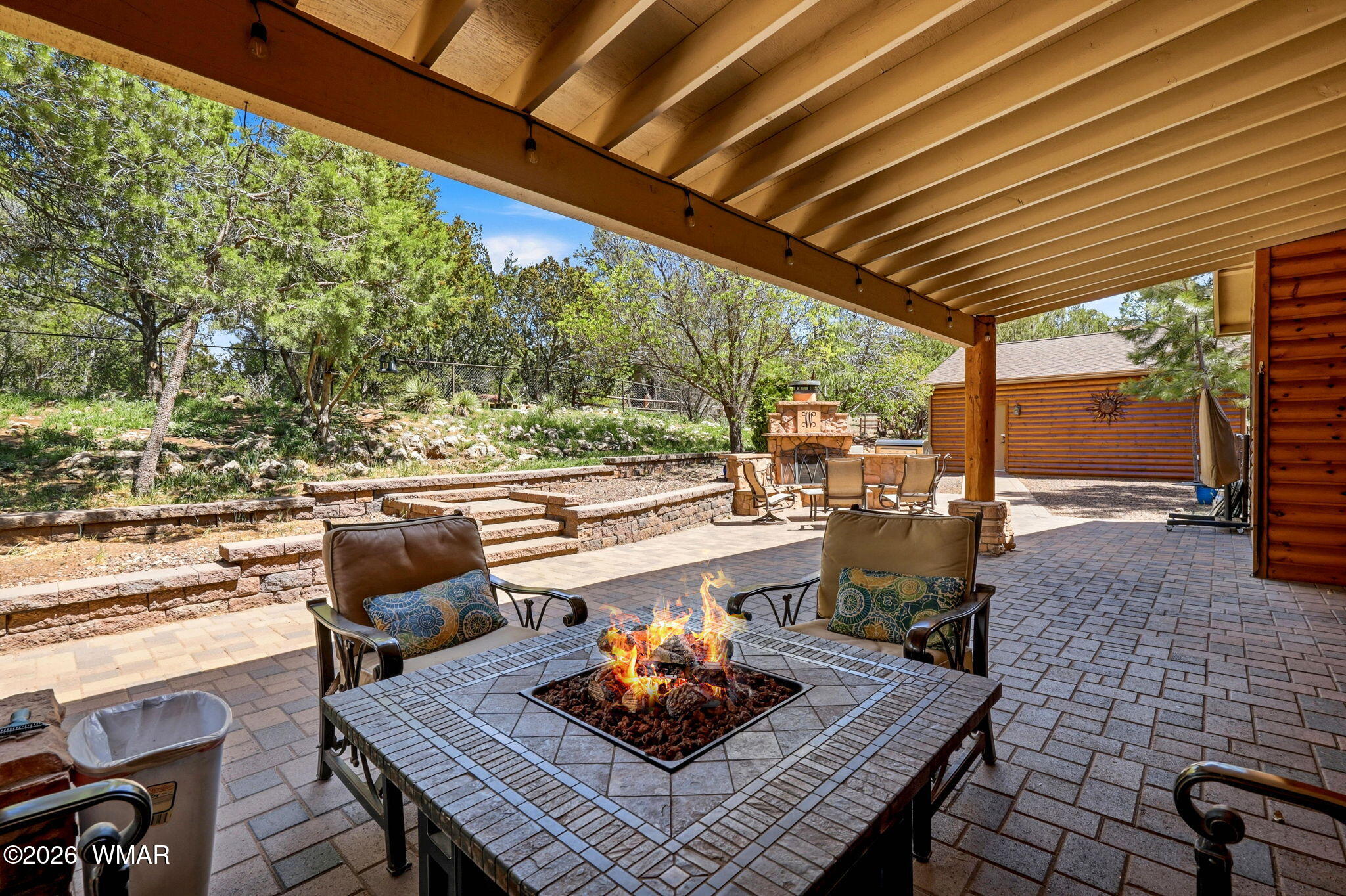 2236 Roundabout Way Overgaard, AZ 85933 - Photo 26 of 45 a living room with patio furniture and a floor to ceiling window