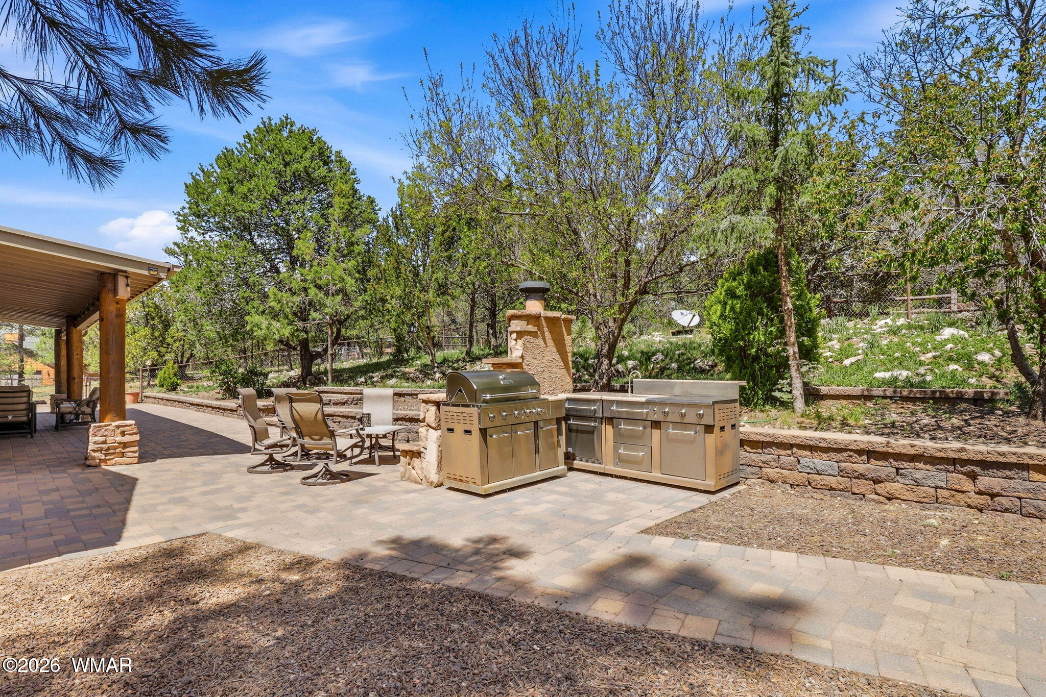 2236 Roundabout Way Overgaard, AZ 85933 - Photo 29 of 45 a view of a patio with a table and chairs