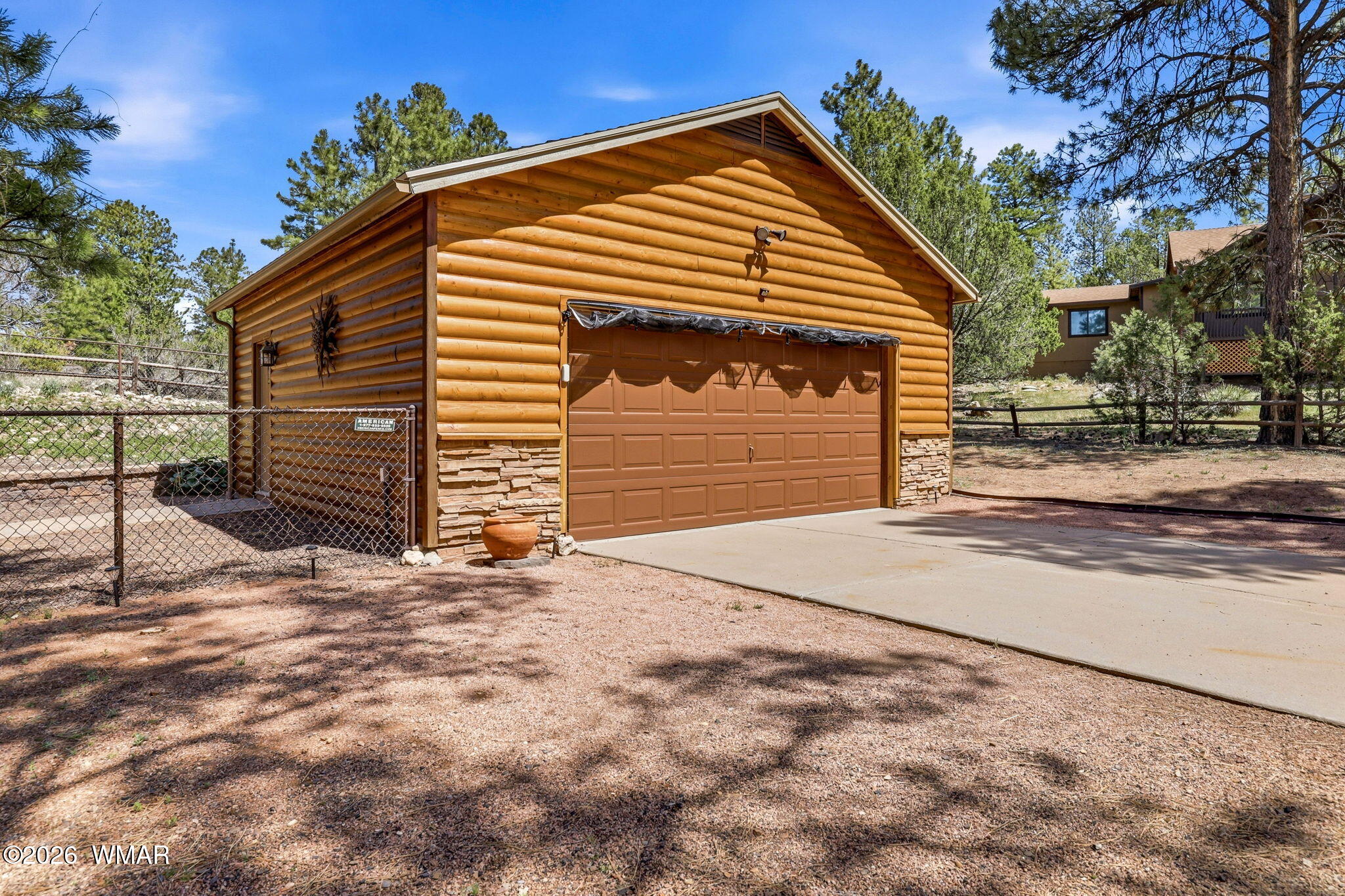2236 Roundabout Way Overgaard, AZ 85933 - Photo 32 of 45 a front view of a house with a yard and garage
