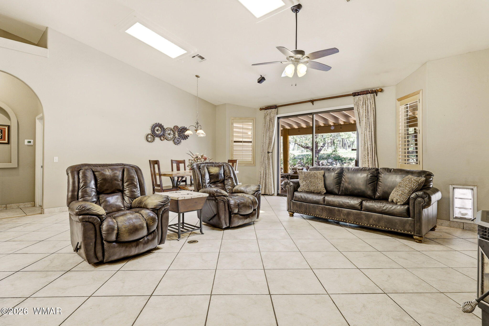 2236 Roundabout Way Overgaard, AZ 85933 - Photo 7 of 45 a living room with furniture and a chandelier