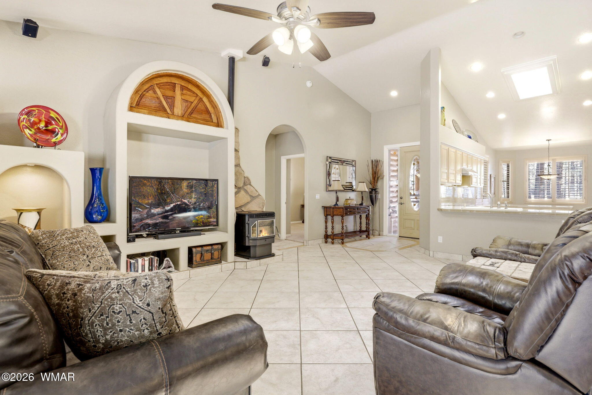 2236 Roundabout Way Overgaard, AZ 85933 - Photo 8 of 45 a living room with furniture a fireplace and a chandelier