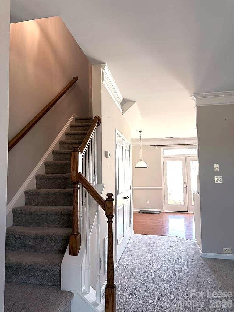 2716 Dunrobin Place Fort Mill, SC 29707 - Photo 11 of 26 a view of entryway and hall with wooden floor