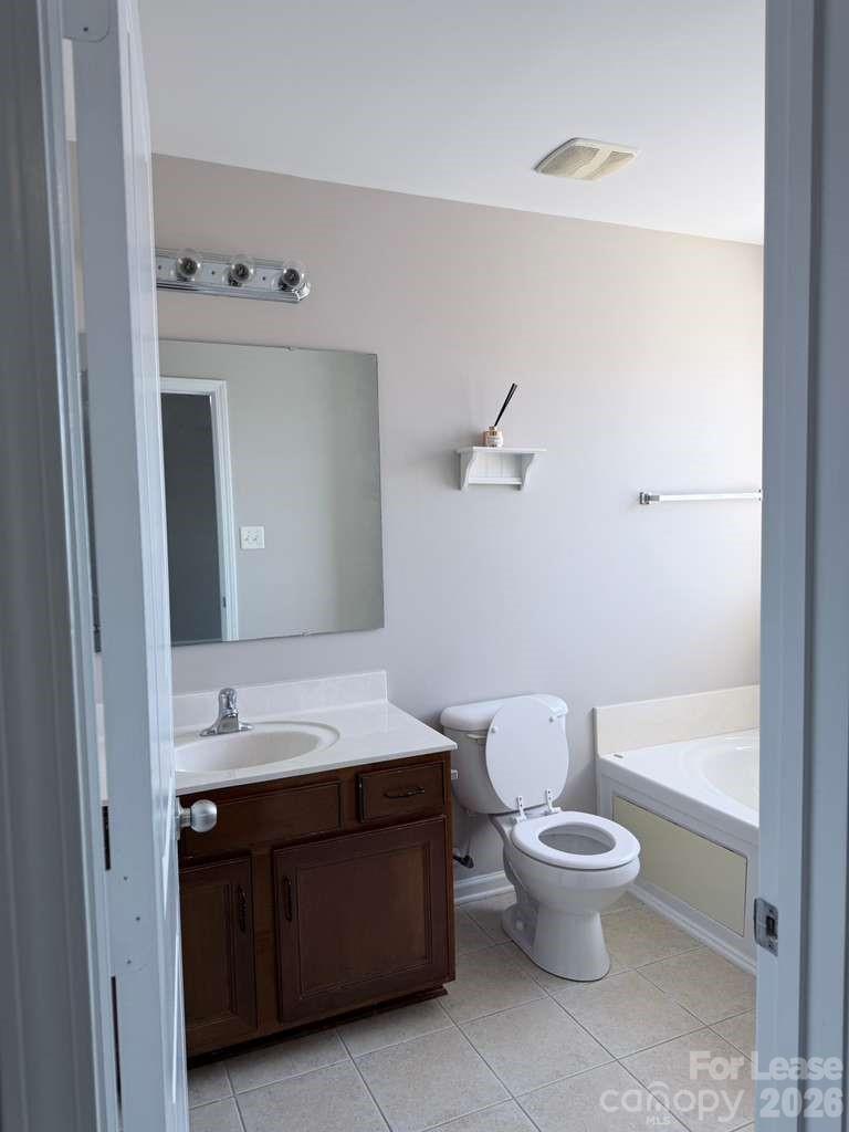 2716 Dunrobin Place Fort Mill, SC 29707 - Photo 14 of 26 a bathroom with a sink a toilet and shower