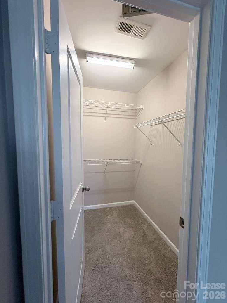 2716 Dunrobin Place Fort Mill, SC 29707 - Photo 16 of 26 a view of a room with racks on the wall