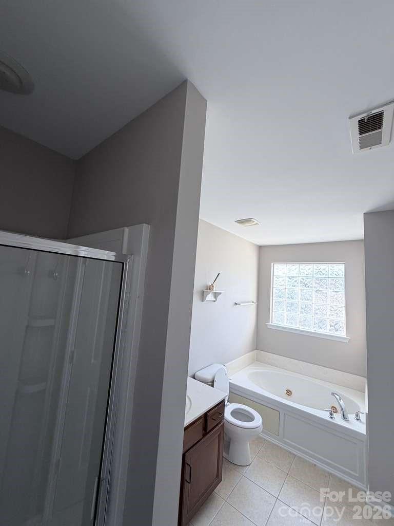 2716 Dunrobin Place Fort Mill, SC 29707 - Photo 19 of 26 a bathroom with a toilet a bath tub and a shower