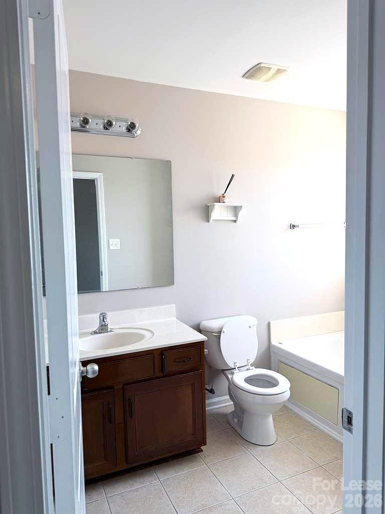 2716 Dunrobin Place Fort Mill, SC 29707 - Photo 21 of 26 a bathroom with a toilet sink and mirror