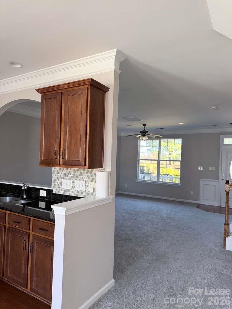 2716 Dunrobin Place Fort Mill, SC 29707 - Photo 7 of 26 a kitchen with granite countertop a sink and a stove