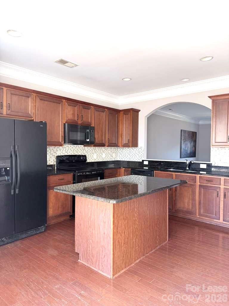 2716 Dunrobin Place Fort Mill, SC 29707 - Photo 8 of 26 a large kitchen with stainless steel appliances and a refrigerator