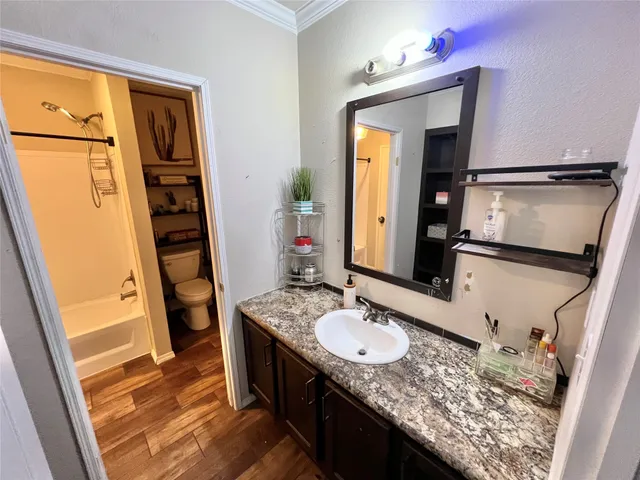 a bathroom with a sink a vanity and mirror