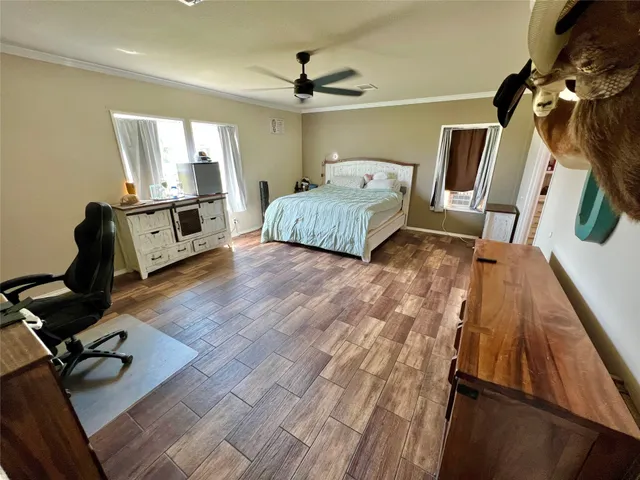 a bedroom with furniture and a window