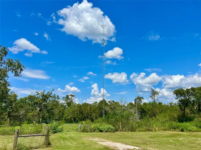 a view of a big yard with lots of swings and slides
