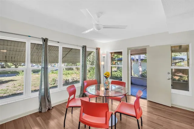 a view of a dining room with furniture window and wooden floor