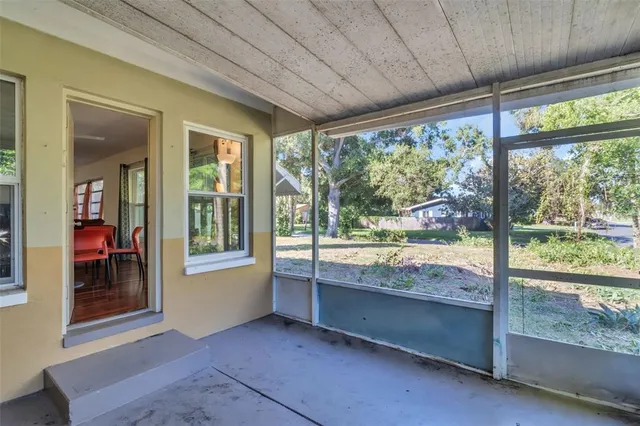 a view of room with window and pool table